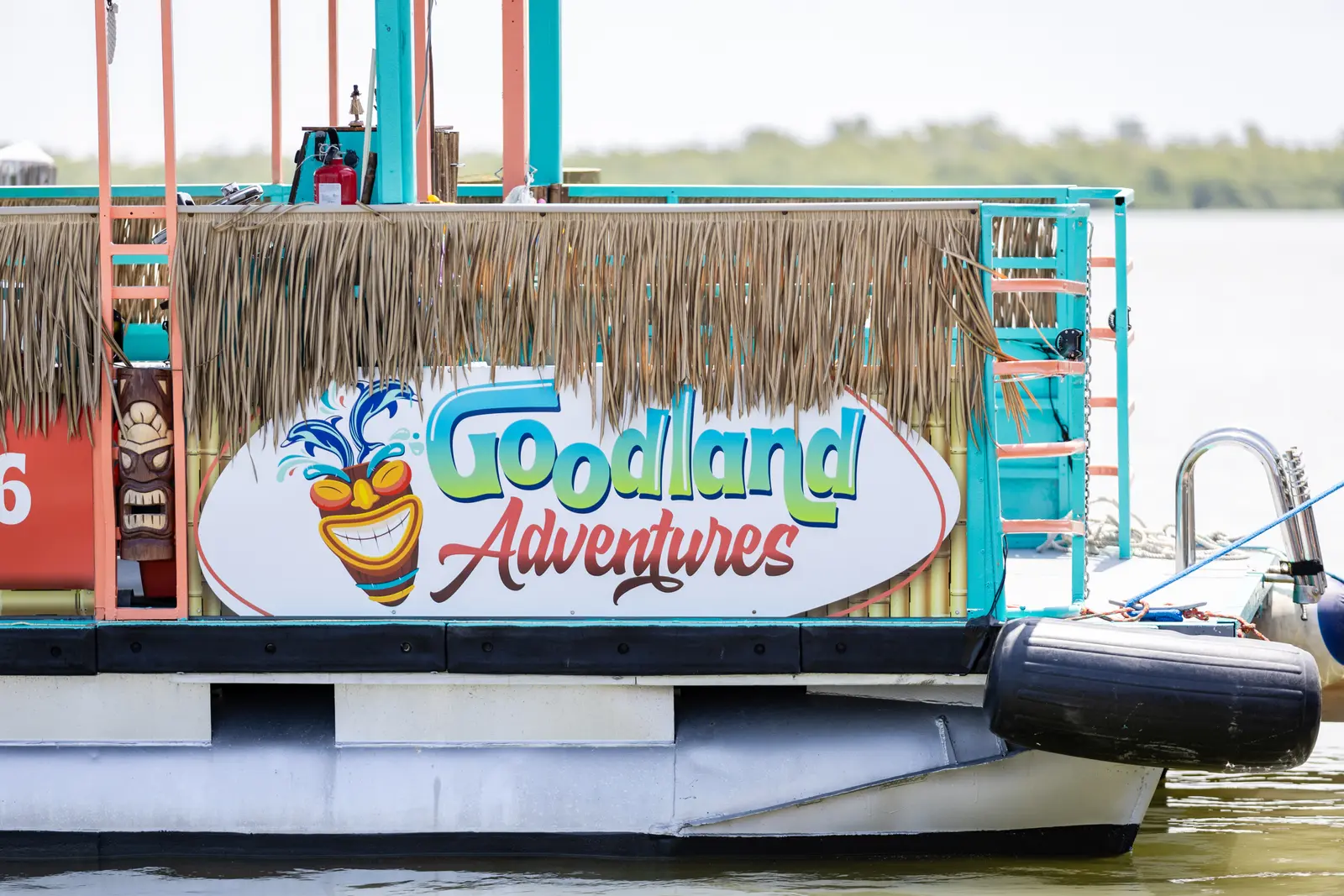 Goodland Adventures Tiki Boat — Branded Side View