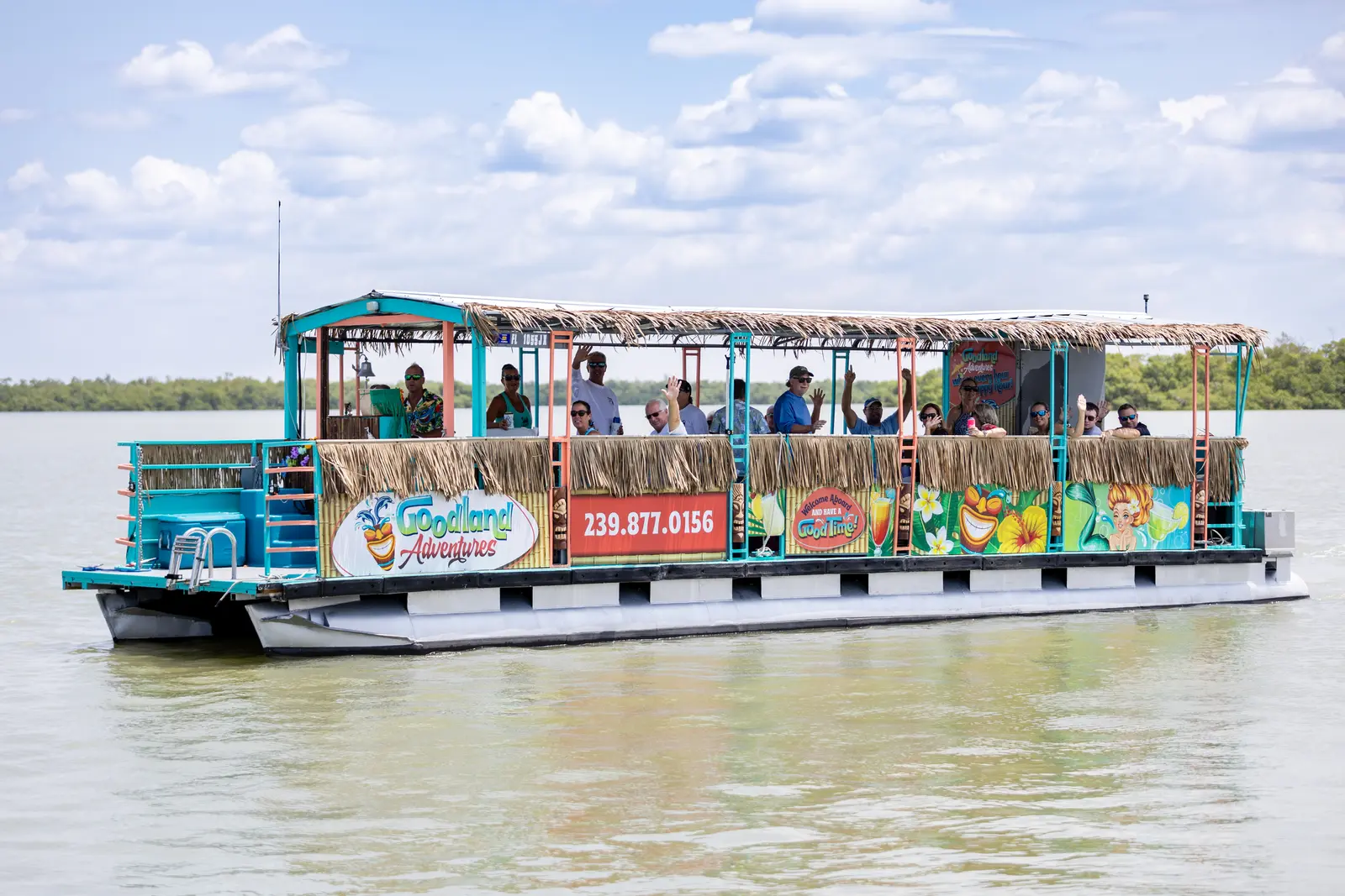 Goodland Adventures Tiki Boat — Full Boat on Water with Passengers